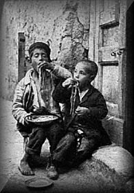 Italian Boys Eating Pasta In Italy